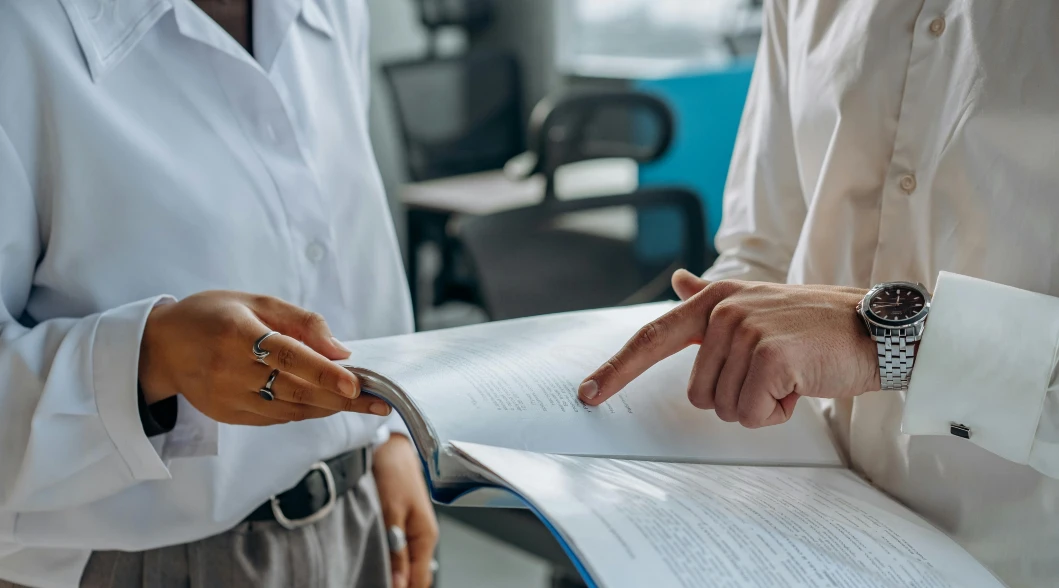two people reading documents two people reading documents
