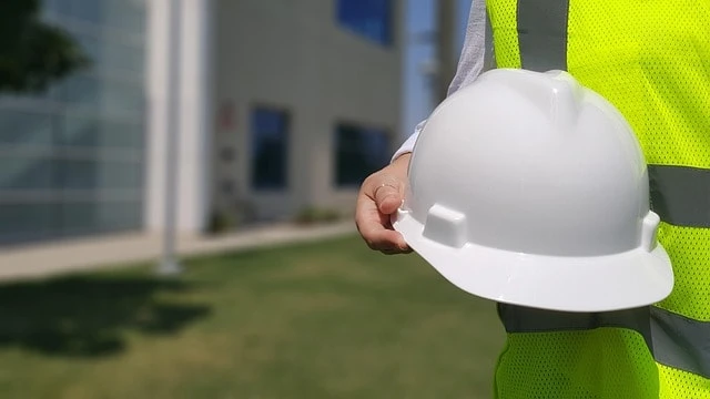 professional home inspector holding a hard hat professional home inspector holding a hard hat