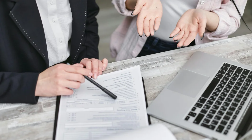 two people discussing insurance policies two people discussing insurance policies