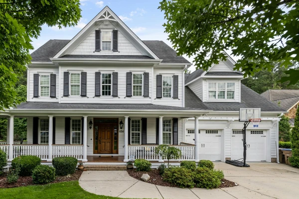 Large house surrounded by trees and shrubs Large house surrounded by trees and shrubs