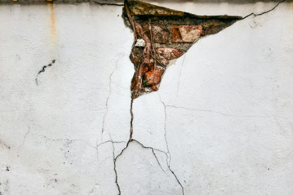 A crack in the side of a house A crack in the side of a house