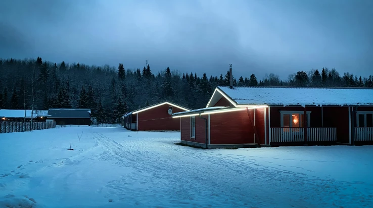brown wooden house on snow covered ground brown wooden house on snow covered ground