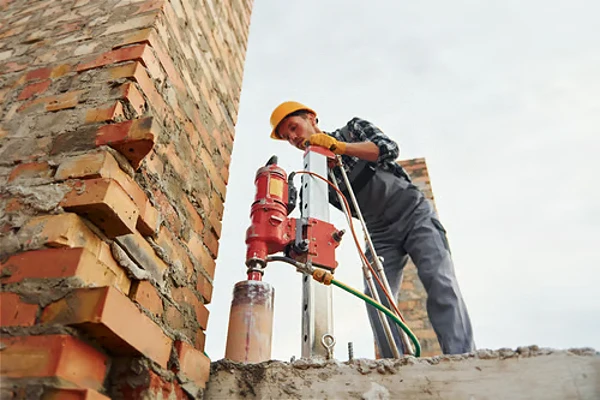 construction worker uses blending drill construction worker uses blending drill